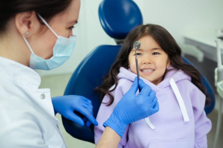 Child at the dentist getting a checkup
