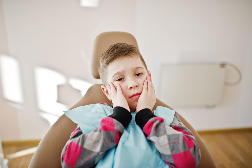 Little boy at dentist chair children dental